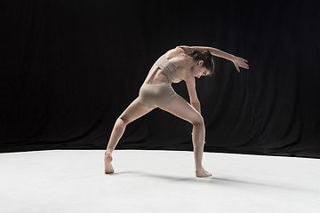 Image showing Young teen dancer on white floor background.