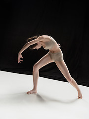 Image showing Young teen dancer on white floor background.