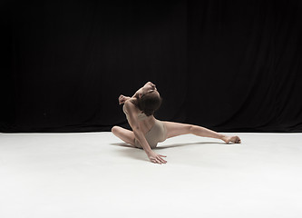 Image showing Young teen dancer on white floor background.