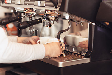 Image showing Barista, cafe, making coffee, preparation and service concept