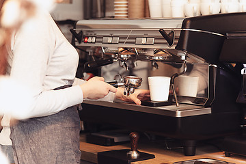 Image showing Barista, cafe, making coffee, preparation and service concept