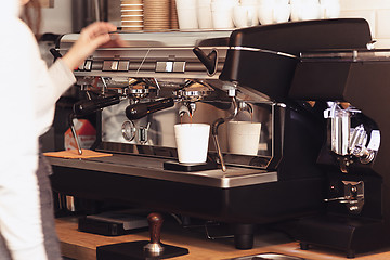 Image showing Barista, cafe, making coffee, preparation and service concept