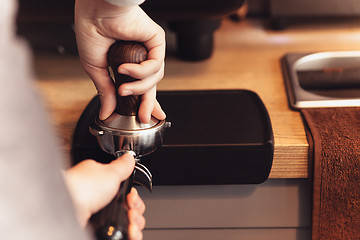 Image showing Barista, cafe, making coffee, preparation and service concept