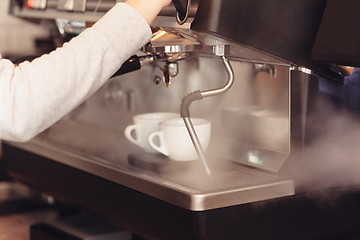 Image showing Barista, cafe, making coffee, preparation and service concept