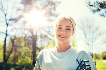 Image showing happy young volunteer woman outdoors