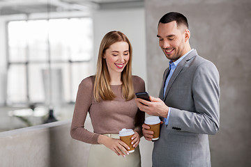 Image showing businesswoman and businessman with smartphone