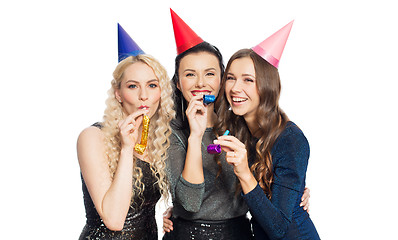 Image showing happy women with party caps hugging