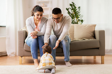 Image showing happy family with baby daughter at home