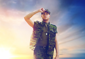 Image showing soldier in military uniform over sky background