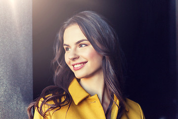 Image showing smiling young woman in city