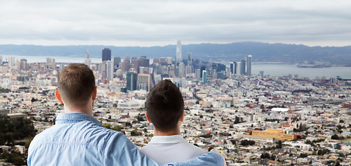 Image showing close up of gay couple hugging over san francisco