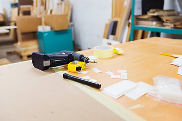 Image showing screwdriver and ruler on table at workshop