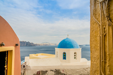 Image showing Unique Santorini architecture, church and sea