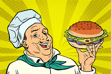 Image showing Cook Chef man presentation gesture. hamburger