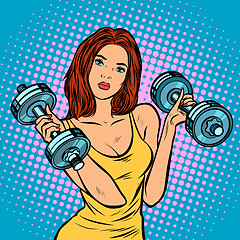 Image showing beautiful woman with dumbbells in gym