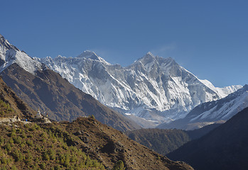 Image showing Group of trekkers, stupa, Everest and Lhotse