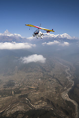Image showing Ultralight plane and trike fly and Machapuchare summit