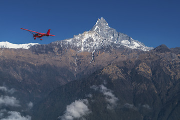 Image showing Ultralight plane flies over Pokhara and Machapuchare