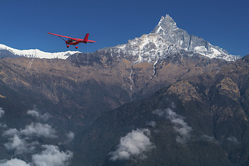 Image showing Ultralight plane flies over Pokhara and Machapuchare