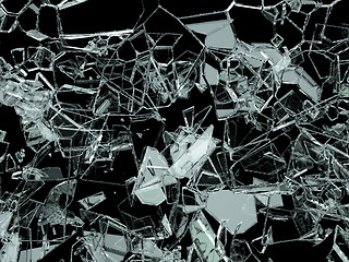 Image showing Pieces of shattered or cracked glass on black