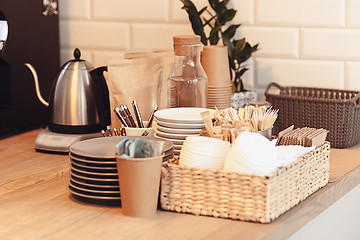 Image showing A table setting for coffee on the counter at a coffee house