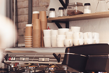 Image showing A table setting for coffee on the counter at a coffee house