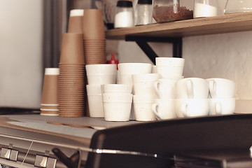 Image showing A table setting for coffee on the counter at a coffee house