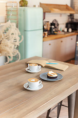 Image showing A table setting for coffee on the counter at a coffee house