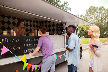 Image showing happy customers queue at food truck