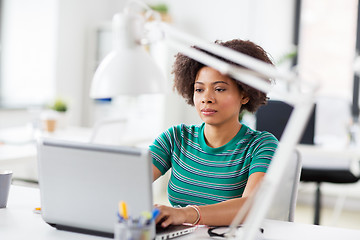 Image showing african woman with laptop computer at office