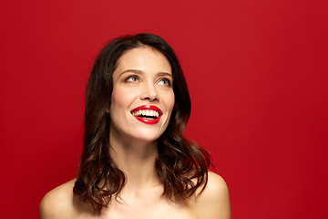 Image showing beautiful smiling young woman with red lipstick