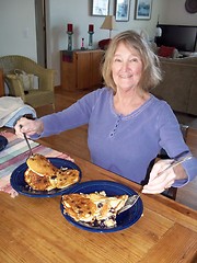 Image showing Female eating pancakes.