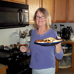 Image showing Female cooking pancakes.