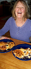 Image showing Female eating pancakes.