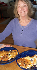 Image showing Female eating pancakes.