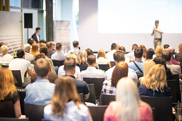 Image showing Business speaker giving a talk at business conference event.