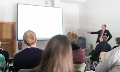 Image showing Business speaker giving a talk at business conference event.