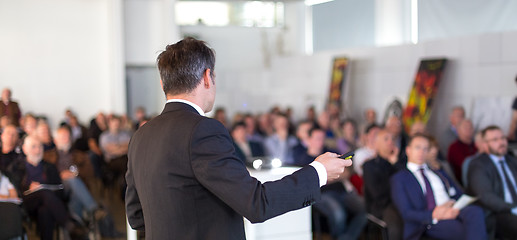 Image showing Public speaker giving talk at Business Event.