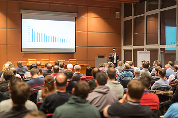 Image showing Business speaker giving a talk at business conference event.