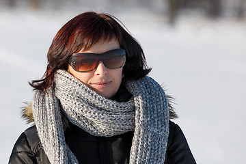 Image showing woman with sunglasses without makeup in winter time