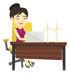 Image showing Woman working with model of wind turbines.