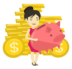 Image showing Business woman holding big piggy bank.