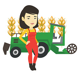 Image showing Farmer standing with combine on background.