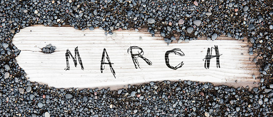 Image showing Sand on planked wood - March