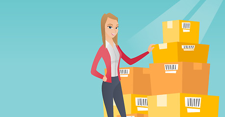 Image showing Business woman checking boxes in warehouse.