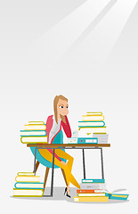 Image showing Student sitting at the table with piles of books.