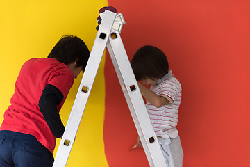 Image showing boys painting wall