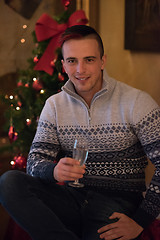 Image showing Happy young man with a glass of champagne