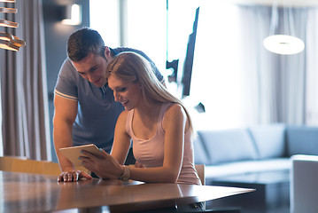 Image showing couple using tablet at home