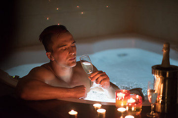 Image showing man relaxing in the jacuzzi